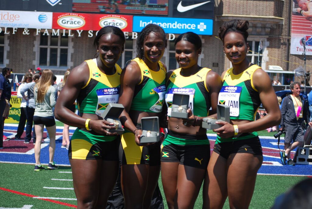 Four athlete wearing green