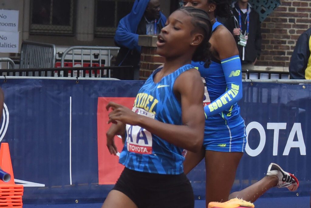 Close up image of a girl running in a marathon
